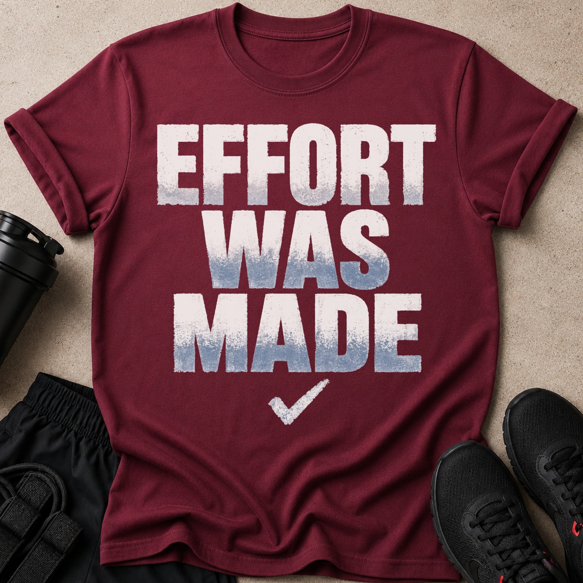 Maroon t-shirt with "EFFORT WAS MADE" text and a checkmark.