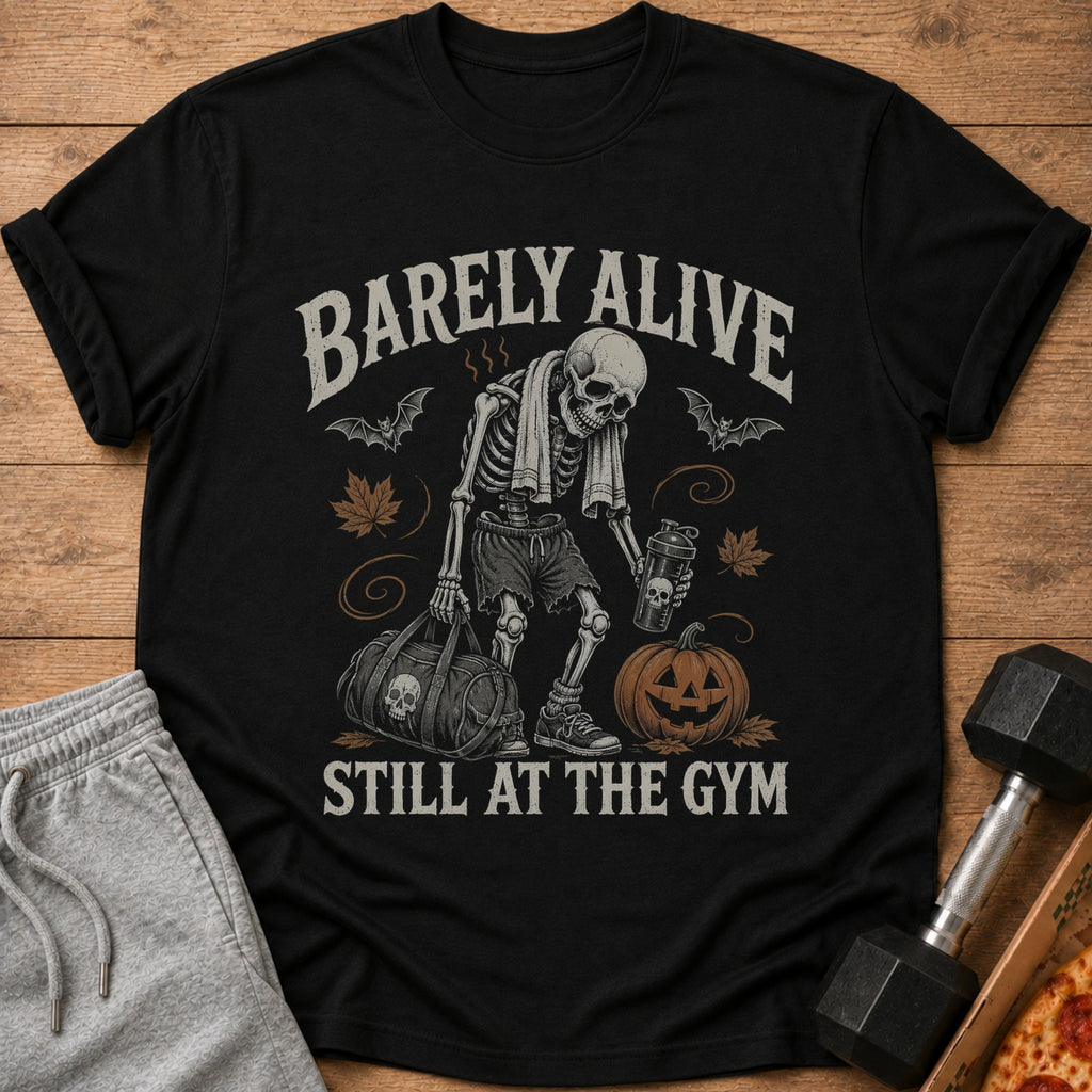 Black t-shirt with skeleton graphic, text "BARELY ALIVE STILL AT THE GYM".