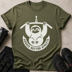 Olive t-shirt with white graphic of a sloth hanging from a bar, reading "Snooze Button Athlete".
