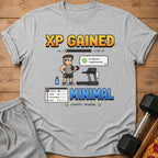 Gray t-shirt with pixel art design "XP GAINED" and workout graphics.