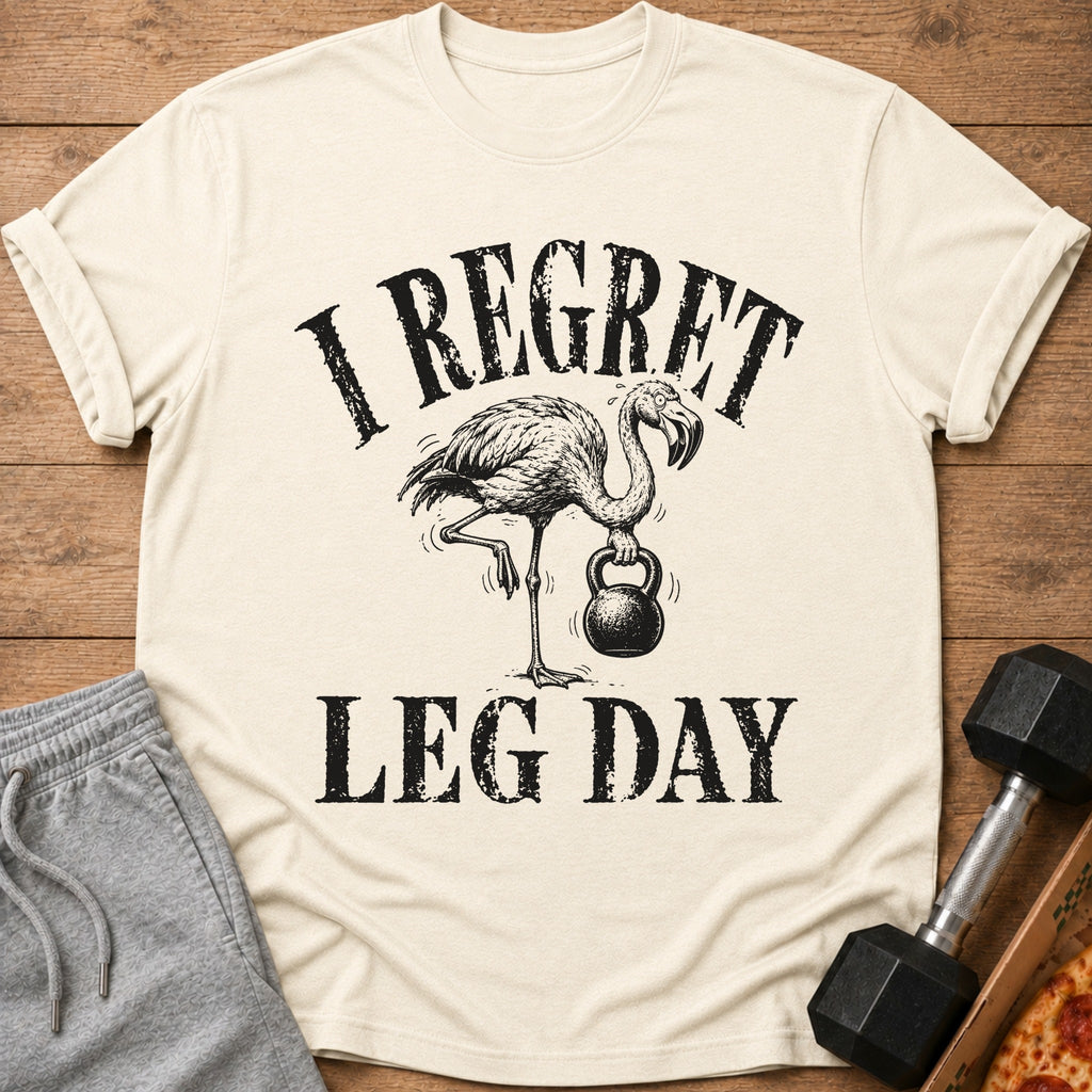 Cream t-shirt with flamingo lifting kettlebell and "I Regret Leg Day" text.