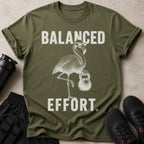 Olive green t-shirt with distressed white text and flamingo graphic.