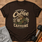Brown t-shirt with graphic of a bear drinking coffee and the text "Powered by Coffee Caffeine & Regret".