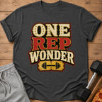 Dark grey t-shirt with text "ONE REP WONDER" and a barbell graphic.