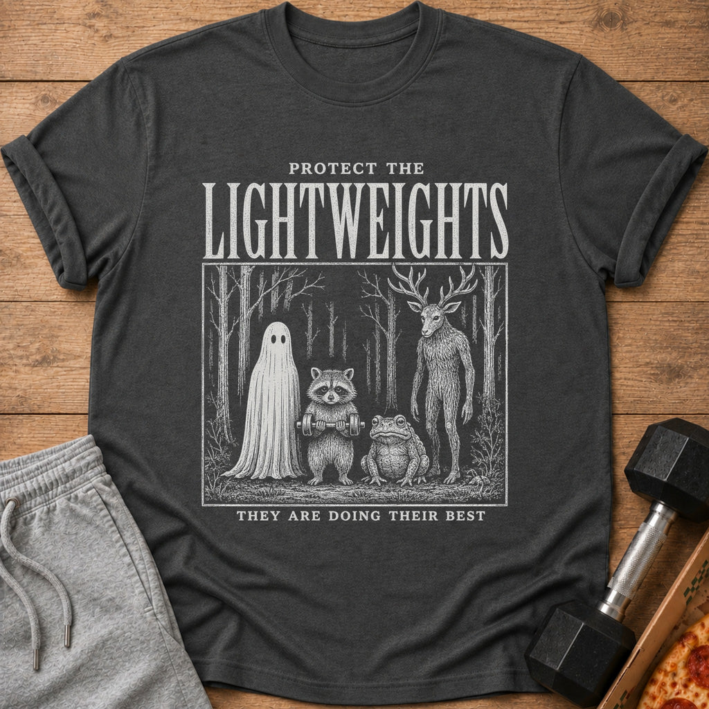Dark t-shirt with white graphic: "Protect the Lightweights" above forest scene with ghost, raccoon, frog, and deer-man.