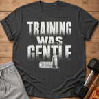 Charcoal t-shirt with "TRAINING WAS GENTLE" text and gym equipment graphics.