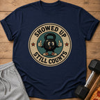 Navy t-shirt with cartoon kettlebell graphic saying "Showed Up Still Counts".
