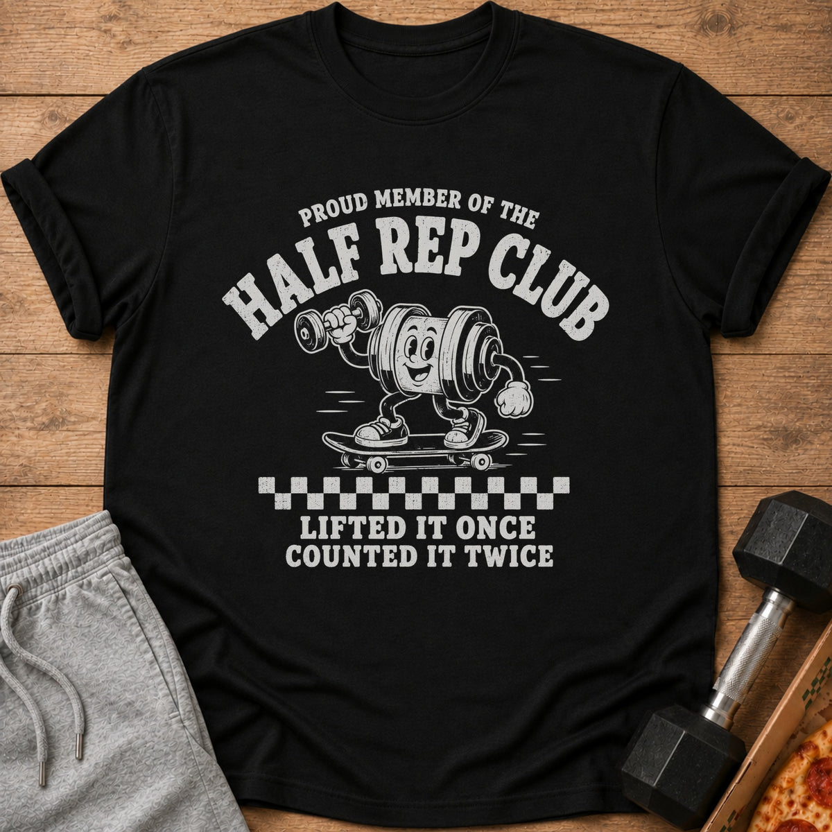 Black t-shirt with "Proud Member of the Half Rep Club" and barbell cartoon.