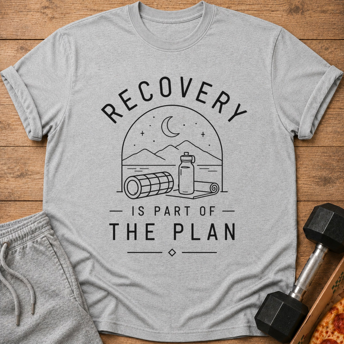 Grey t-shirt with "RECOVERY IS PART OF THE PLAN" graphic and fitness imagery.