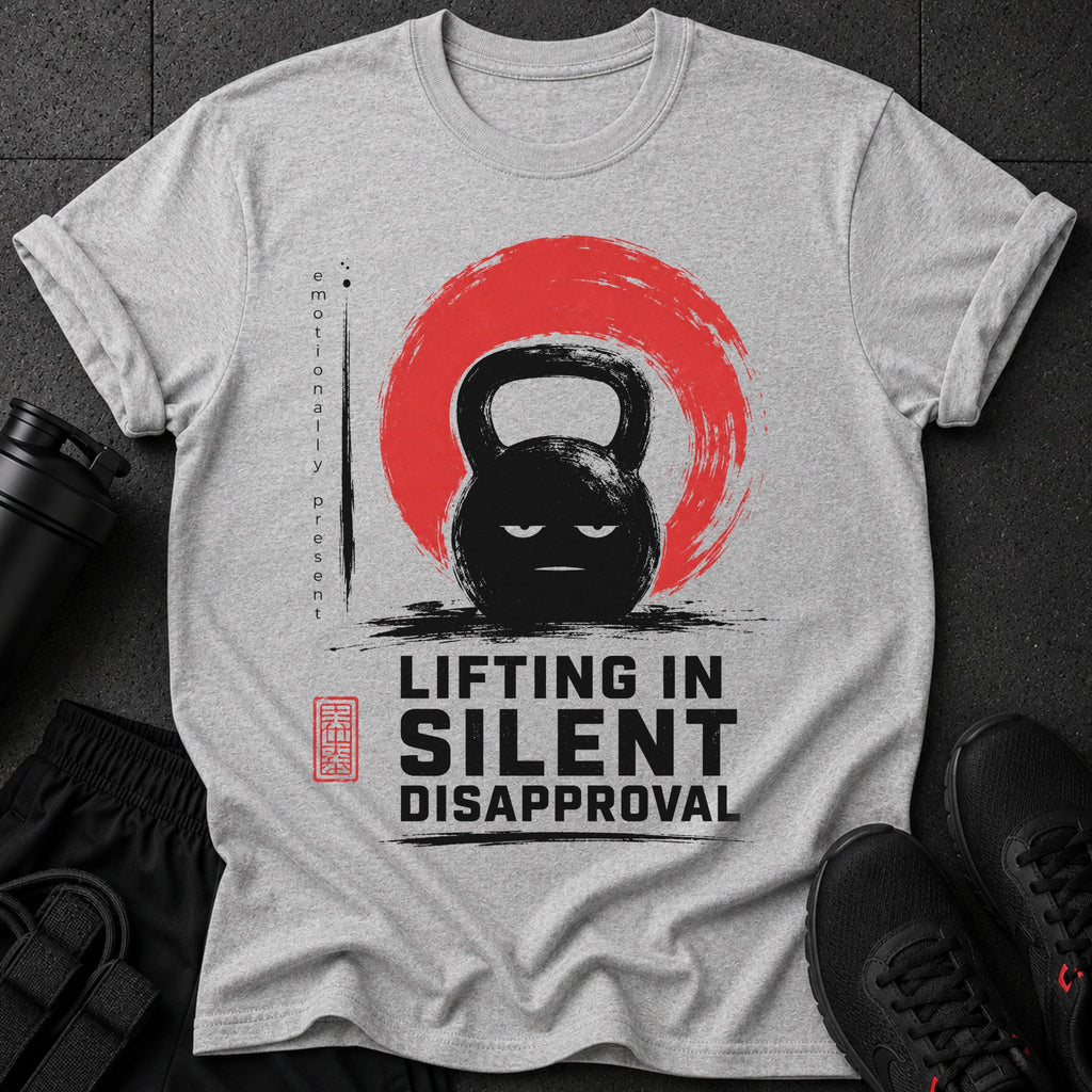 Grey t-shirt with a stern kettlebell graphic and "Lifting in Silent Disapproval" text.