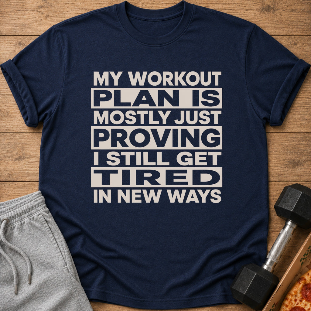 Navy t-shirt with "My workout plan is mostly just proving I still get tired in new ways" text.