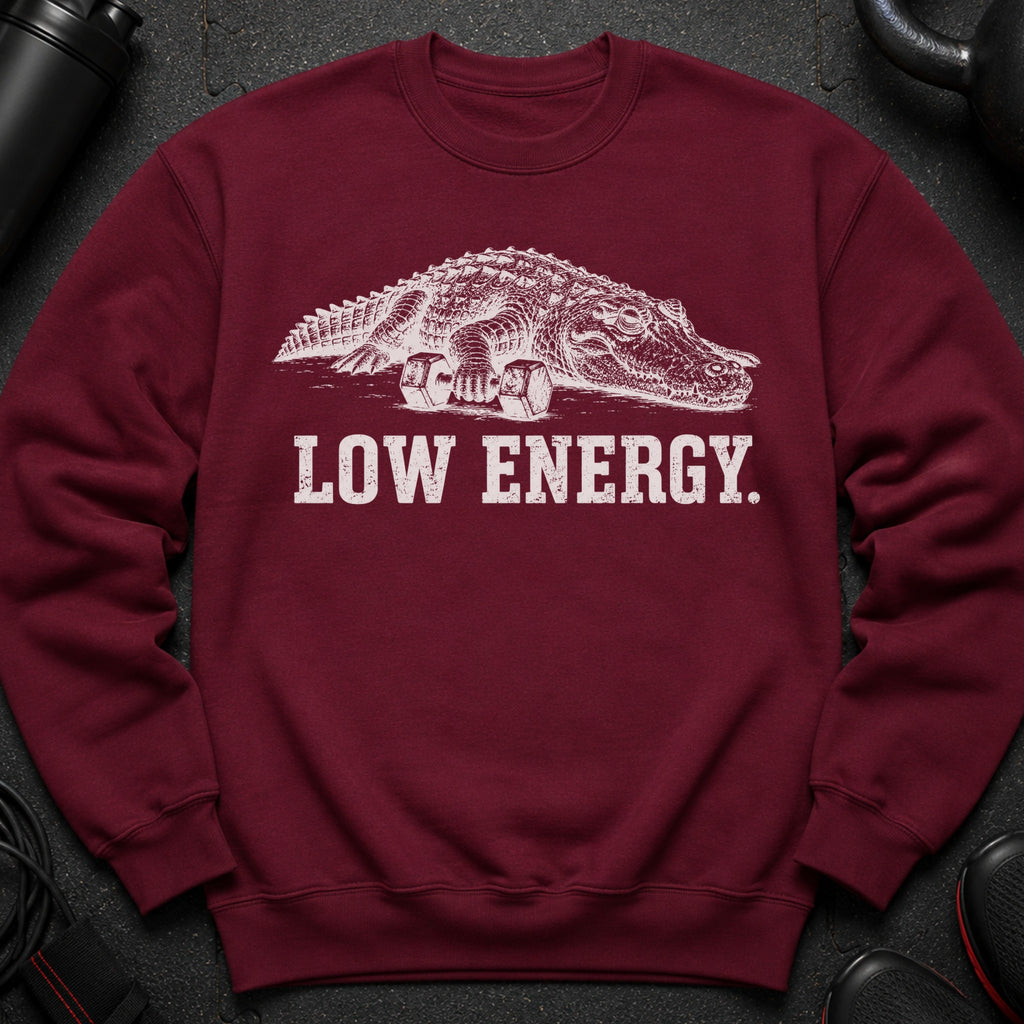 Maroon sweatshirt with white graphic of alligator holding dumbbells and text "LOW ENERGY."
