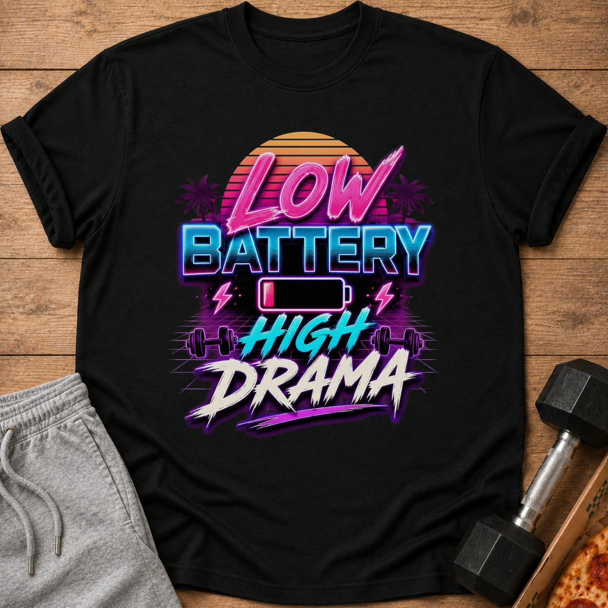 Black t-shirt with "Low Battery High Drama" text, battery icon, and dumbbells.