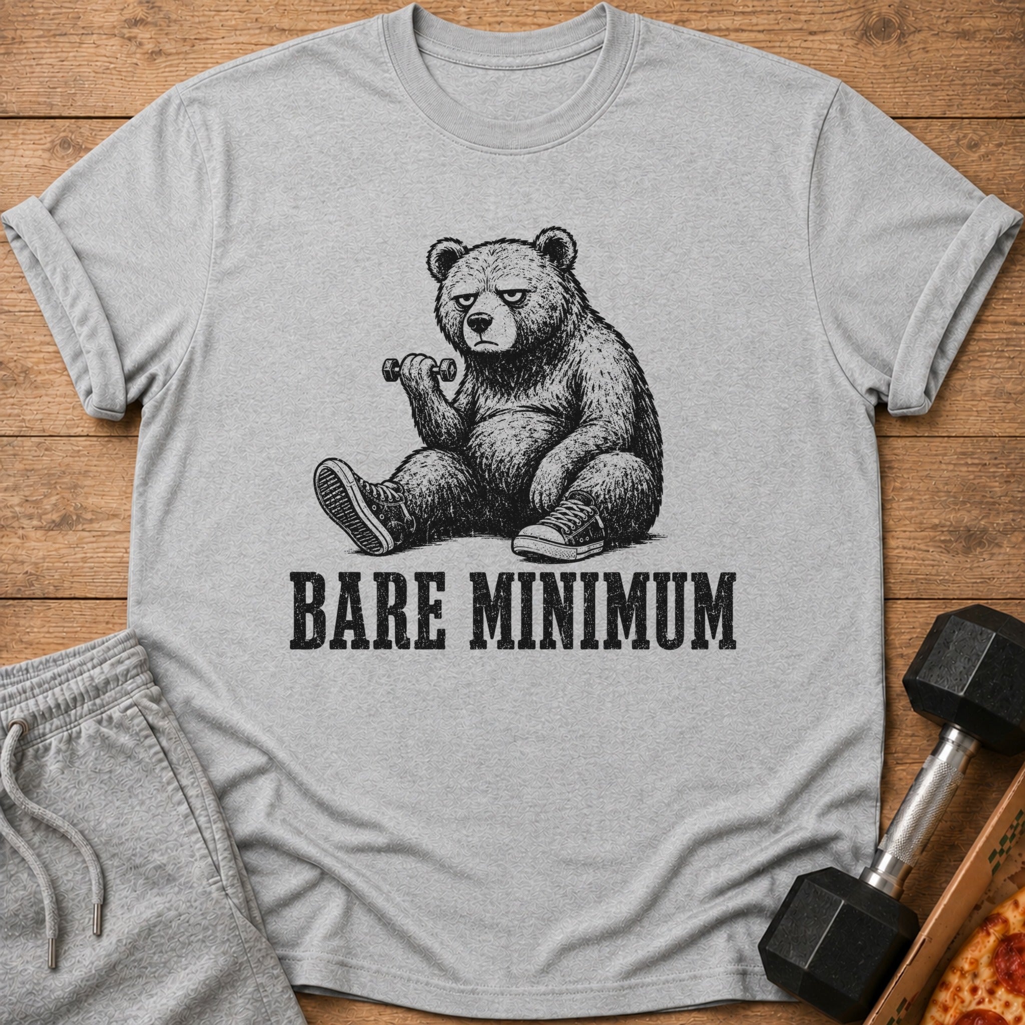 T-shirt with sketch of bear lifting dumbbell and text "BARE MINIMUM".