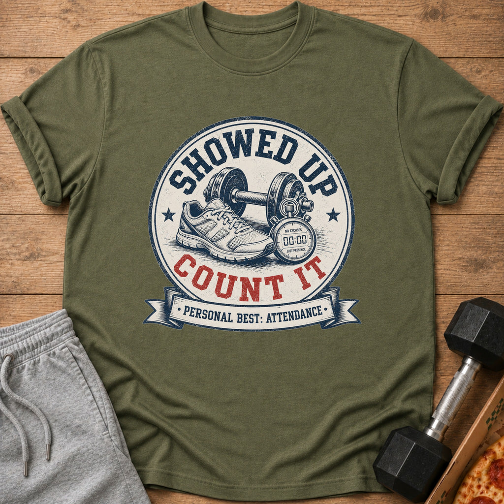 Olive green t-shirt with "Showed Up Count It" graphic featuring dumbbell, shoe, and stopwatch.