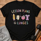 Black t-shirt with "Lesson Plans & Lunges" and cartoon pencil, coffee, apple, and dumbbell.