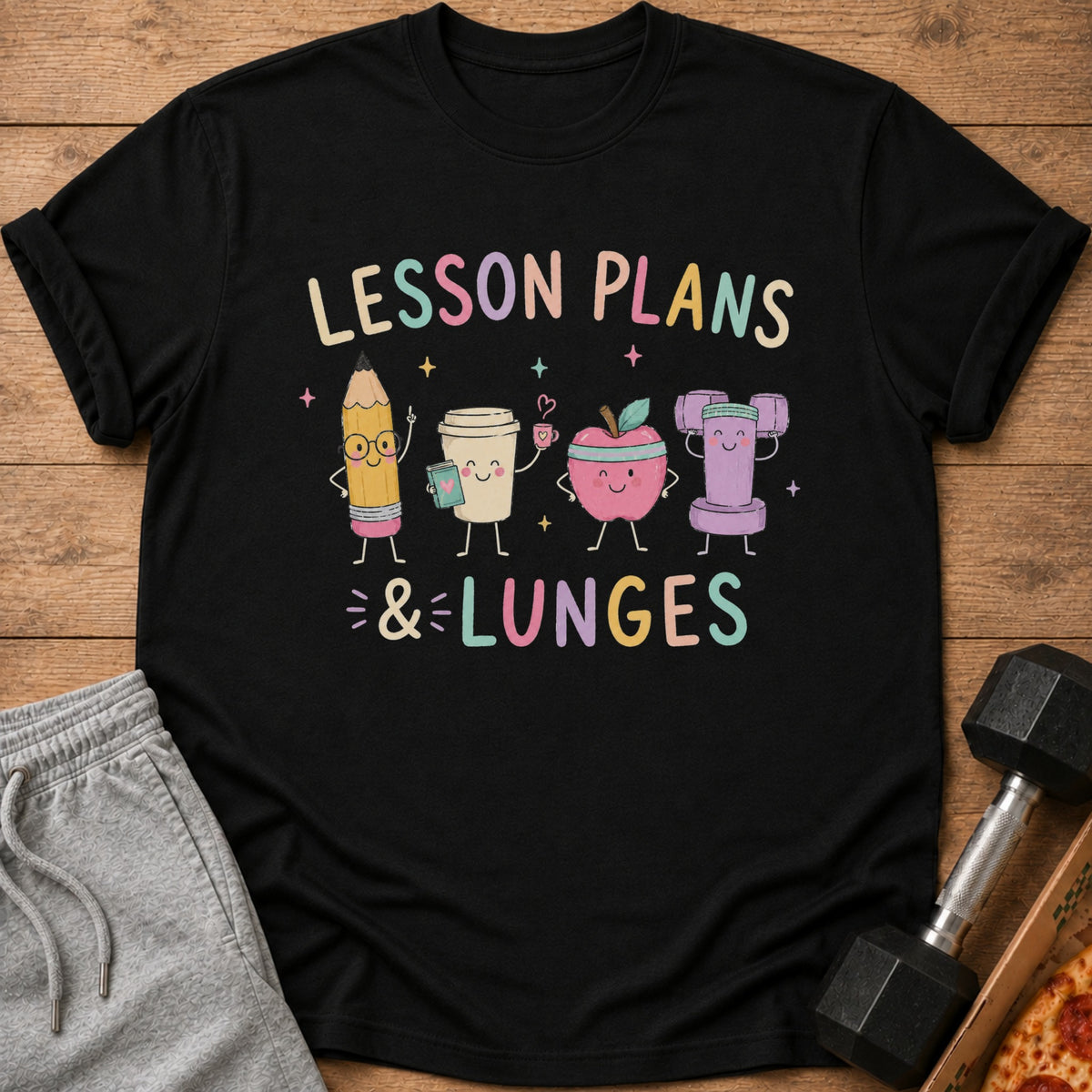 Black t-shirt with "Lesson Plans & Lunges" and cartoon pencil, coffee, apple, and dumbbell.