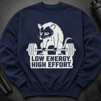 Navy sweatshirt with opossum lifting weights and text "Low Energy. High Effort."