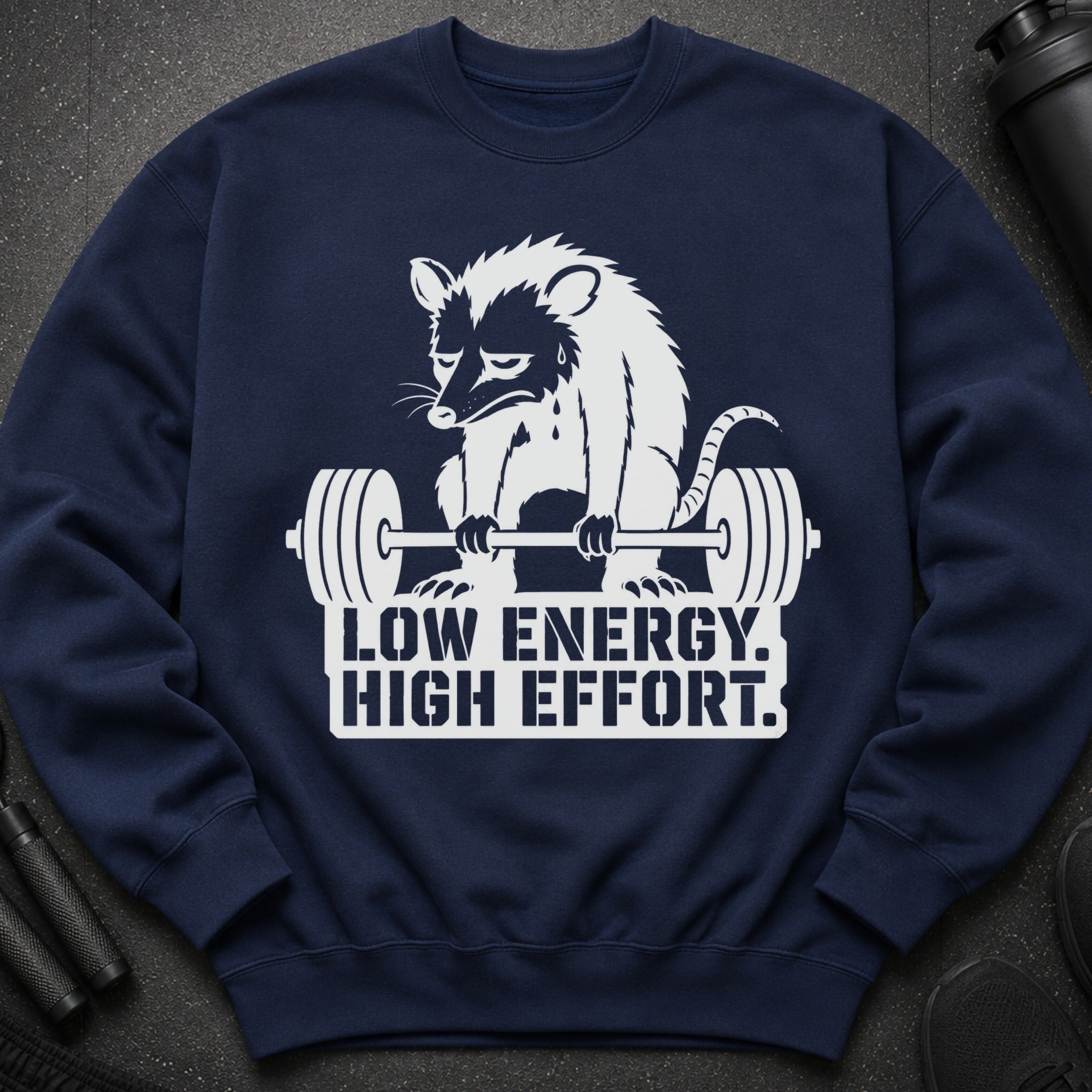 Navy sweatshirt with opossum lifting weights and text "Low Energy. High Effort."