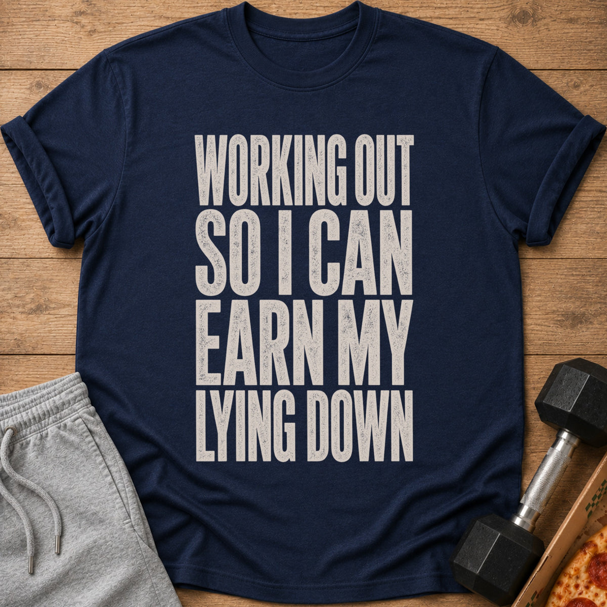 Navy t-shirt with text "WORKING OUT SO I CAN EARN MY LYING DOWN".