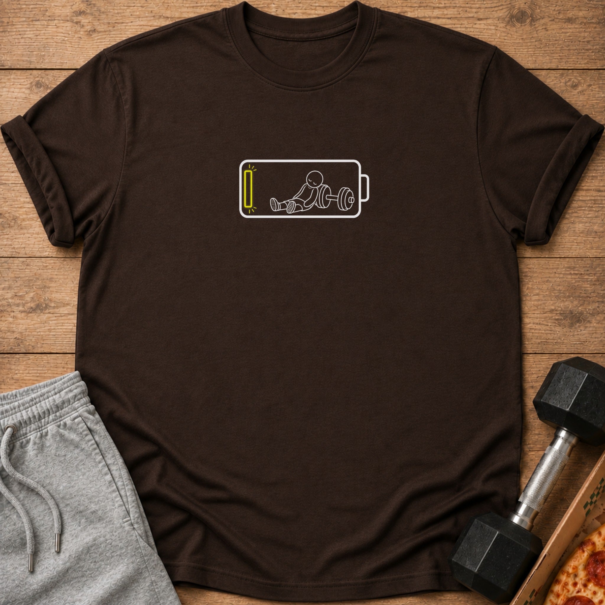 Brown t-shirt with a white graphic of a stick figure and a low battery symbol.