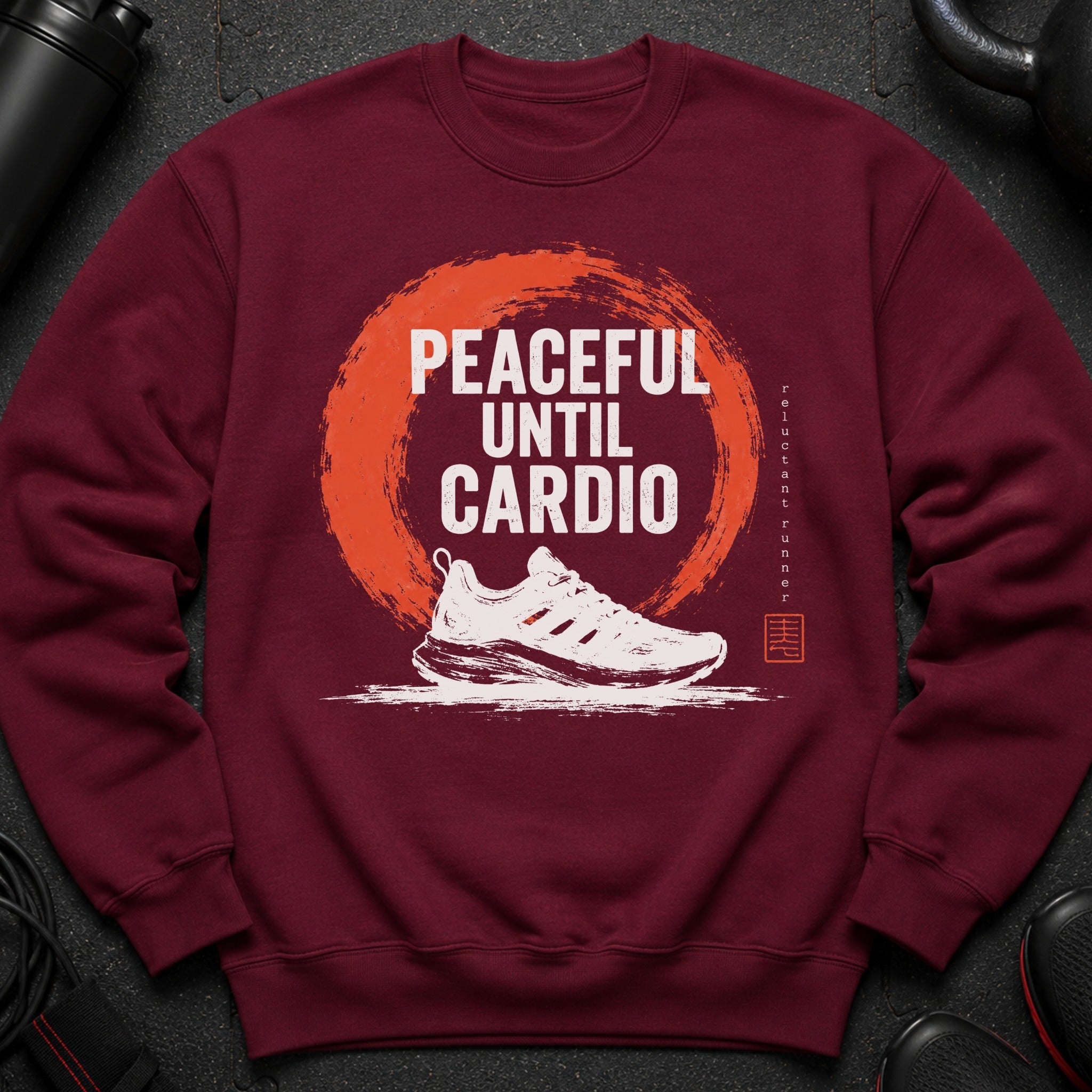 Maroon sweatshirt with "PEACEFUL UNTIL CARDIO" text and running shoe graphic.