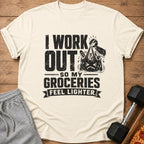 Light cream t-shirt with black text: "I Work Out So My Groceries Feel Lighter."