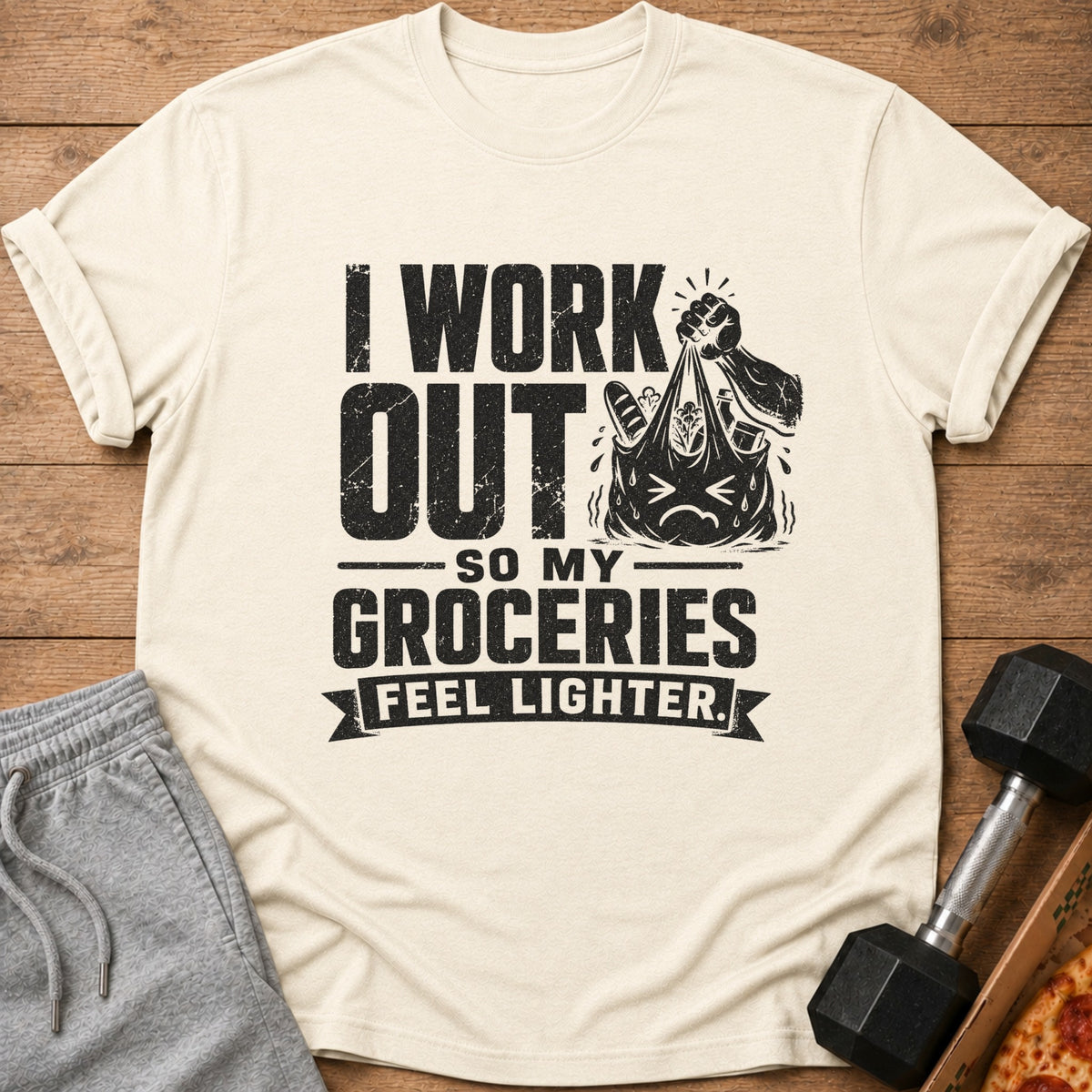 Light cream t-shirt with black text: "I Work Out So My Groceries Feel Lighter."