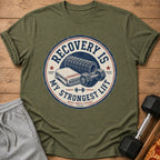 Green t-shirt with circular graphic "Recovery is My Strongest Lift Rest Reps Count."