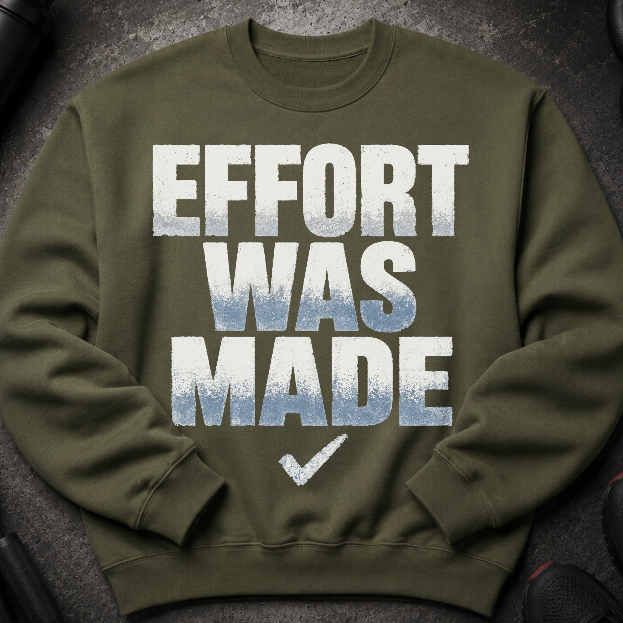 Olive green sweatshirt with "EFFORT WAS MADE" and a checkmark graphic.