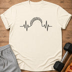 T-shirt with a taco and heartbeat graphic, grey sweatpants, dumbbell, and pizza.