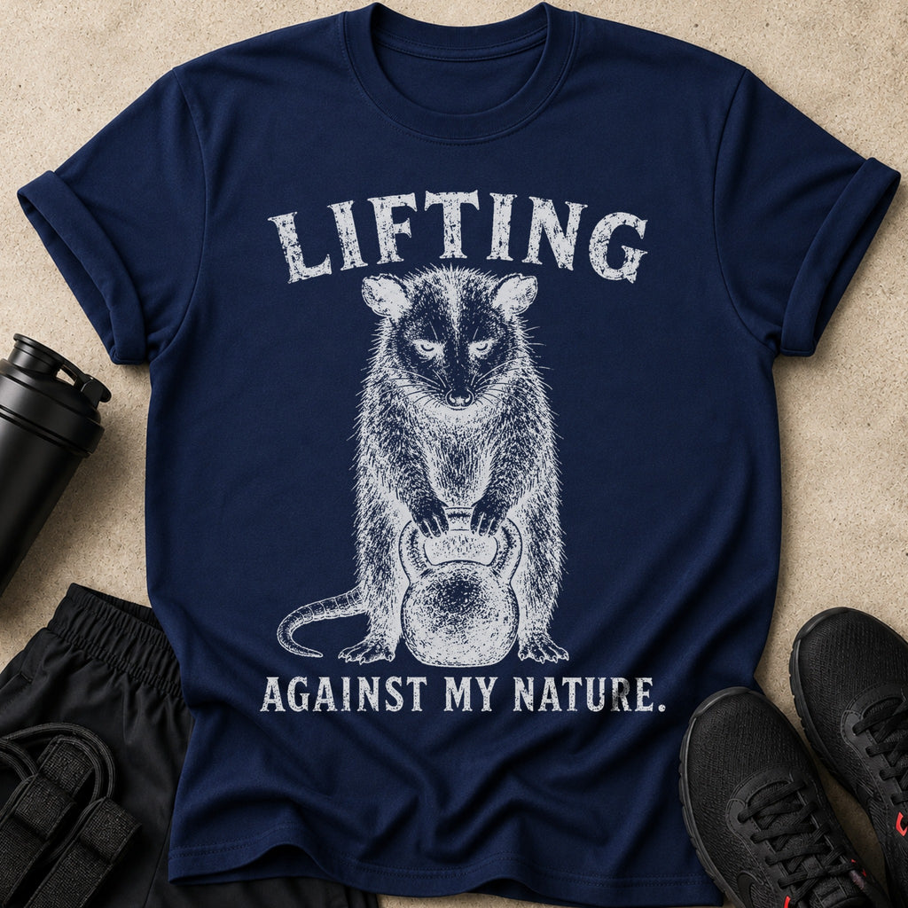 Navy t-shirt with text "LIFTING AGAINST MY NATURE" and a drawing of a possum holding a kettlebell.