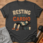 Dark gray t-shirt with "RESTING IS MY CARDIO" text and illustration of a person resting on a bench.