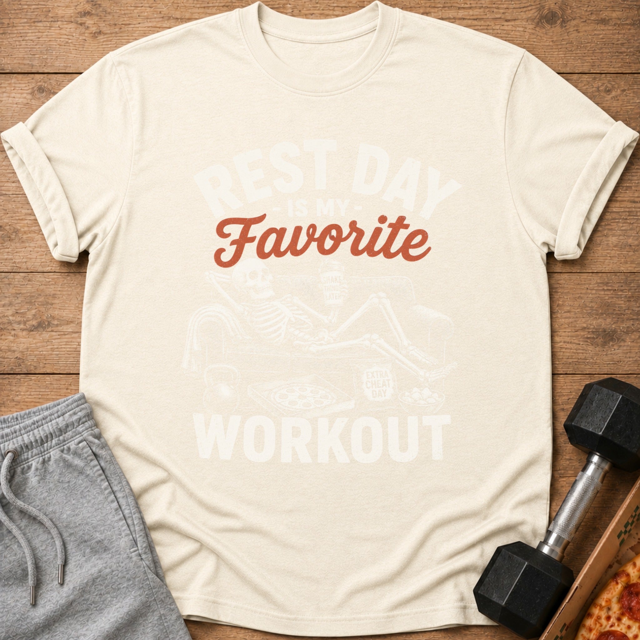 Light beige t-shirt with skeleton graphic and text "REST DAY IS MY FAVORITE WORKOUT".