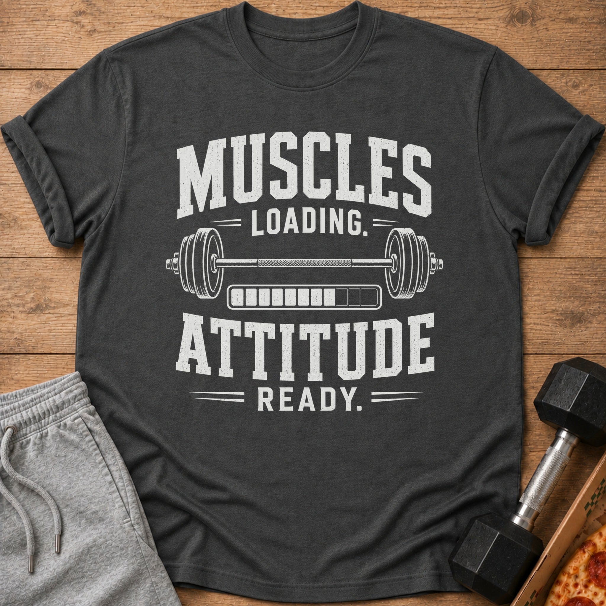 Dark gray t-shirt with "Muscles Loading. Attitude Ready." text and barbell graphic.