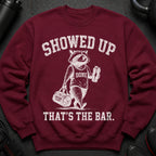 Maroon sweatshirt with a raccoon wearing a "DONE" tank top holding a shaker and gym bag.