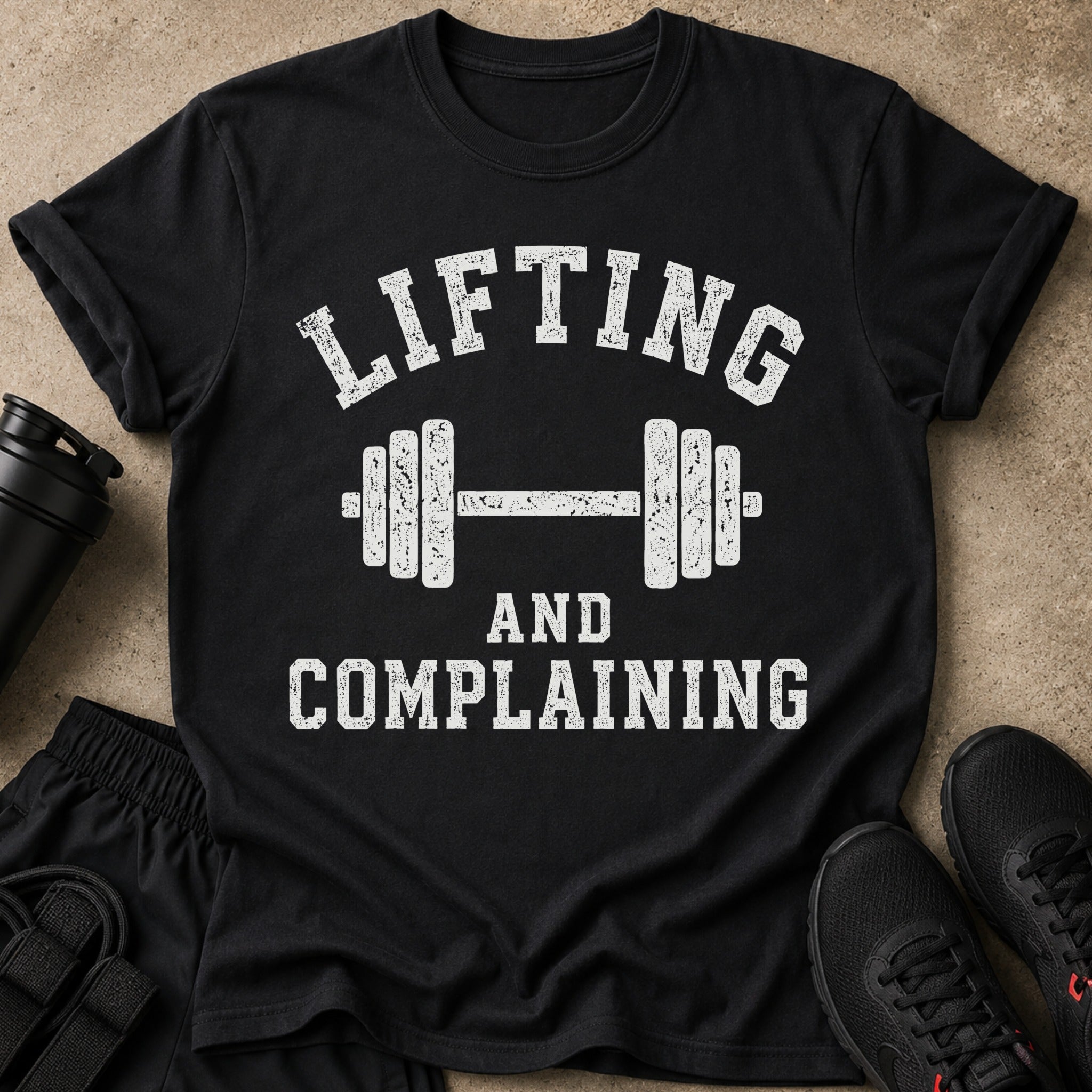 Black t-shirt with "Lifting and Complaining" text and dumbbell graphic.