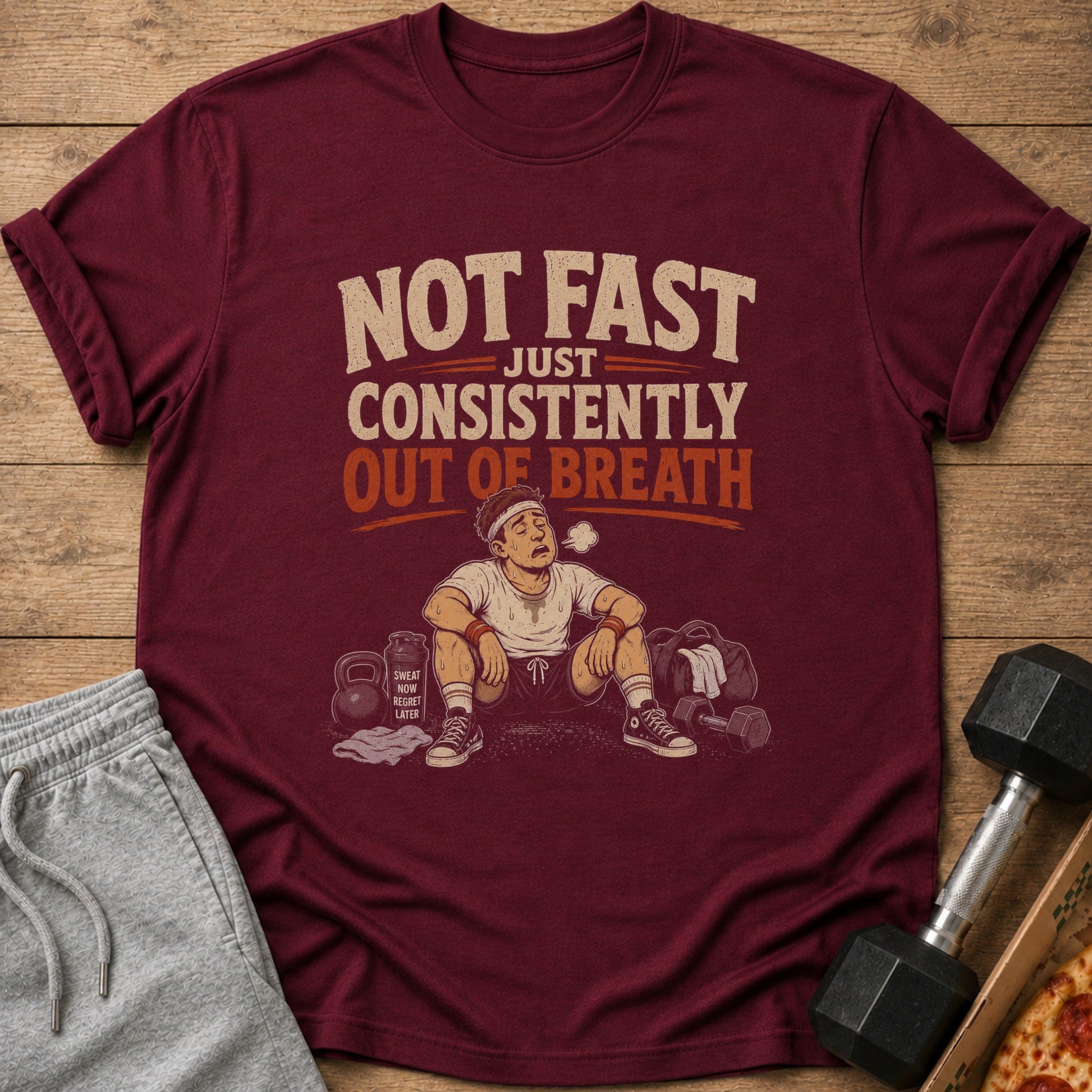 Maroon t-shirt with "NOT FAST JUST CONSISTENTLY OUT OF BREATH" graphic.