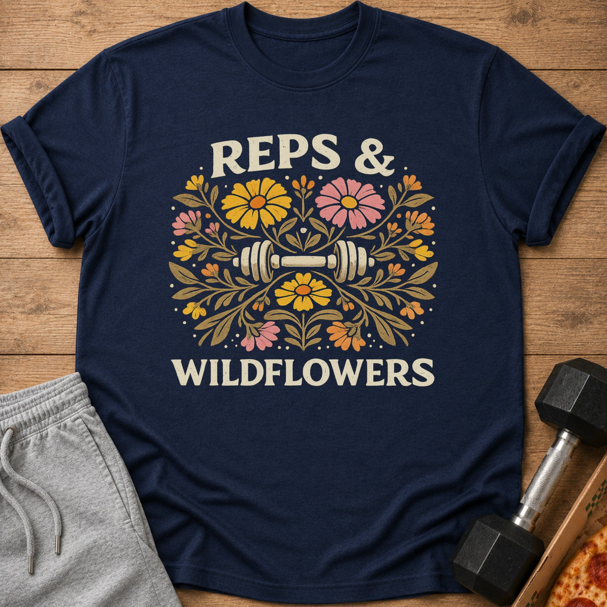 Navy t-shirt with dumbbell and floral design, saying "Reps & Wildflowers."