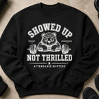 Black sweatshirt with a panda lifting weights, text reads "SHOWED UP NOT THRILLED ATTENDANCE MATTERS."