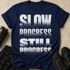 Navy t-shirt with white distressed text: SLOW PROGRESS STILL PROGRESS
