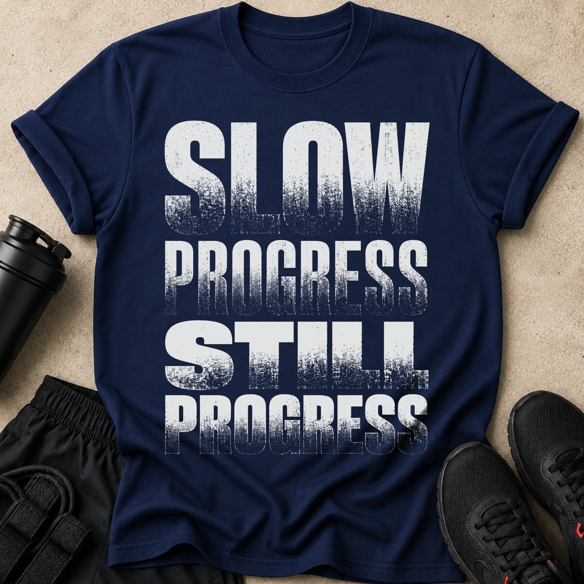 Navy t-shirt with white distressed text: SLOW PROGRESS STILL PROGRESS