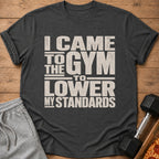 Dark t-shirt with "I CAME TO THE GYM TO LOWER MY STANDARDS" text.