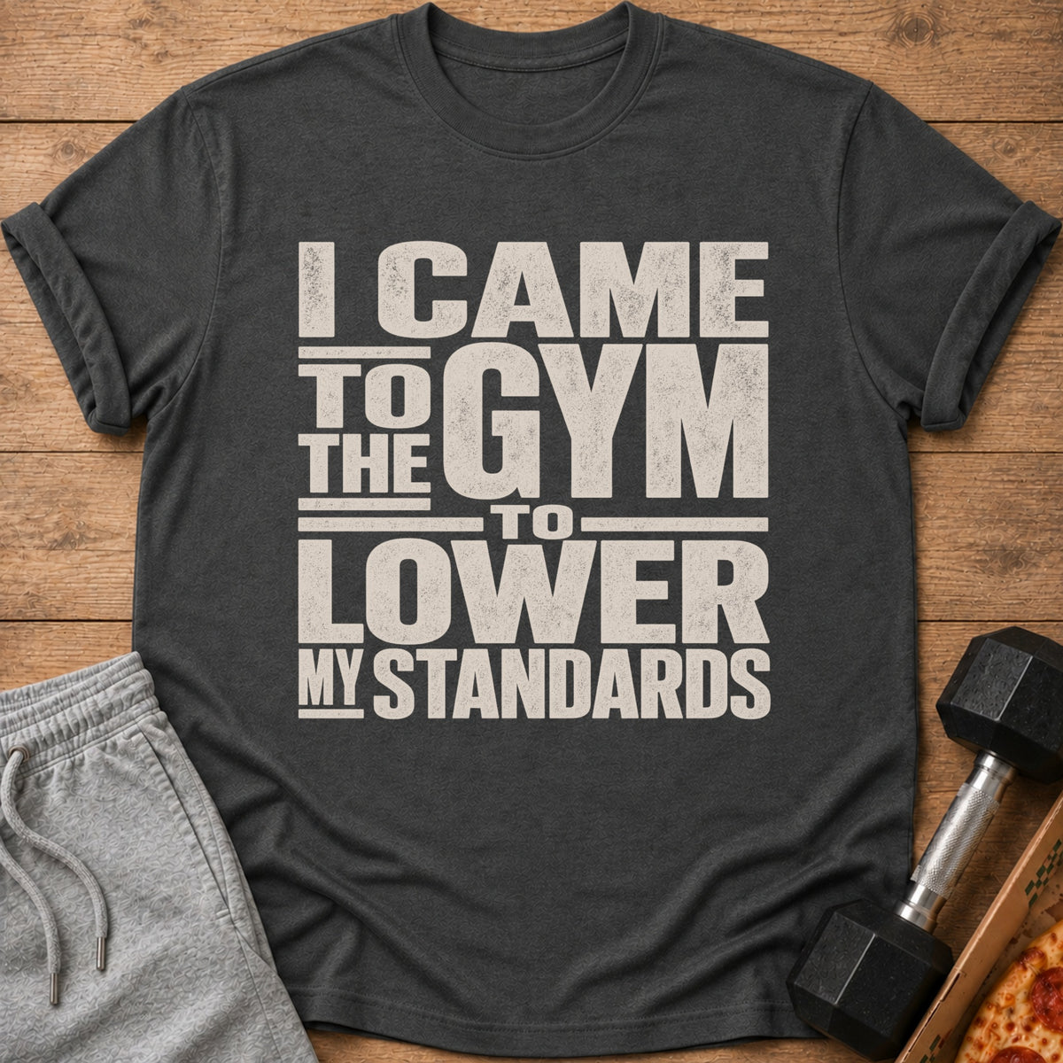 Dark t-shirt with "I CAME TO THE GYM TO LOWER MY STANDARDS" text.