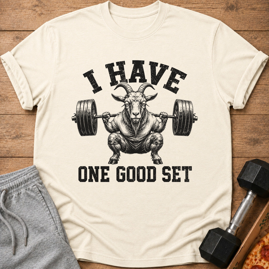 Cream t-shirt with goat lifting barbell and text "I HAVE ONE GOOD SET".