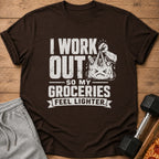 Brown t-shirt with text "I WORK OUT SO MY GROCERIES FEEL LIGHTER" and grocery bag graphic.