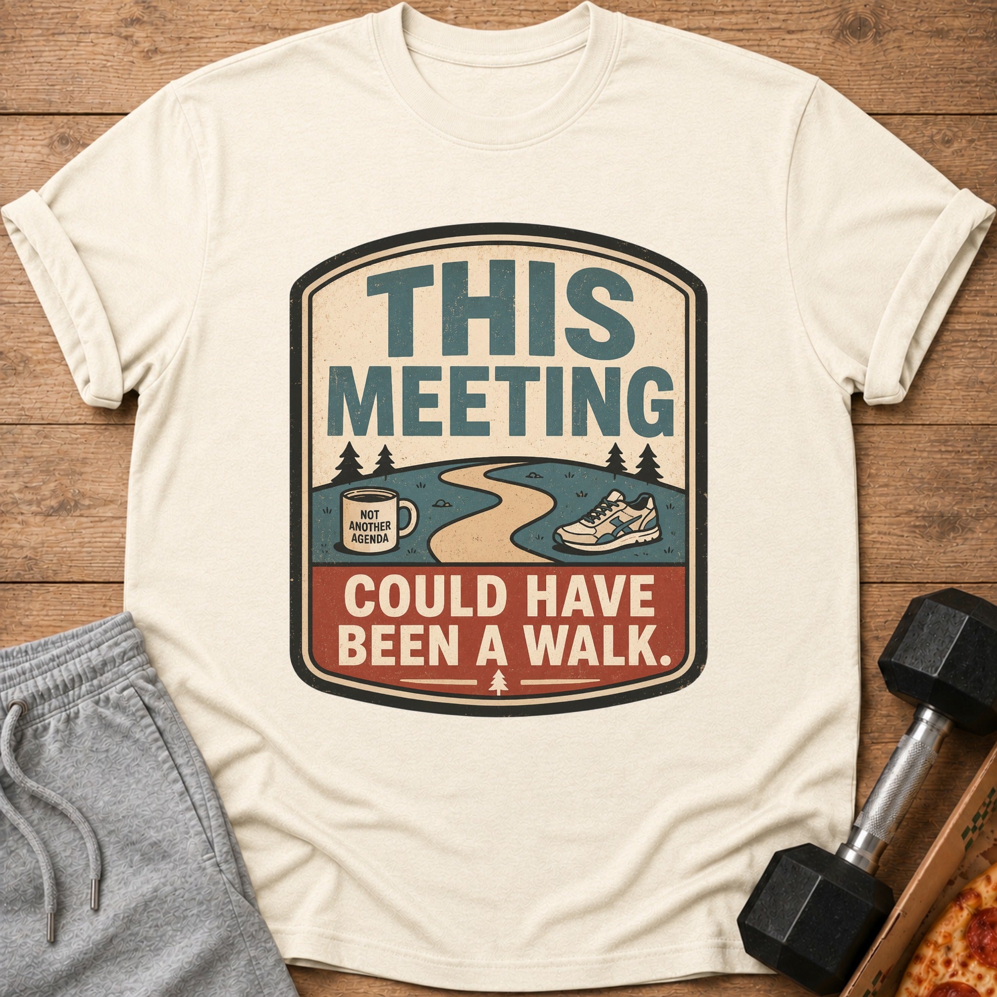 Cream t-shirt with "THIS MEETING COULD HAVE BEEN A WALK" graphic.