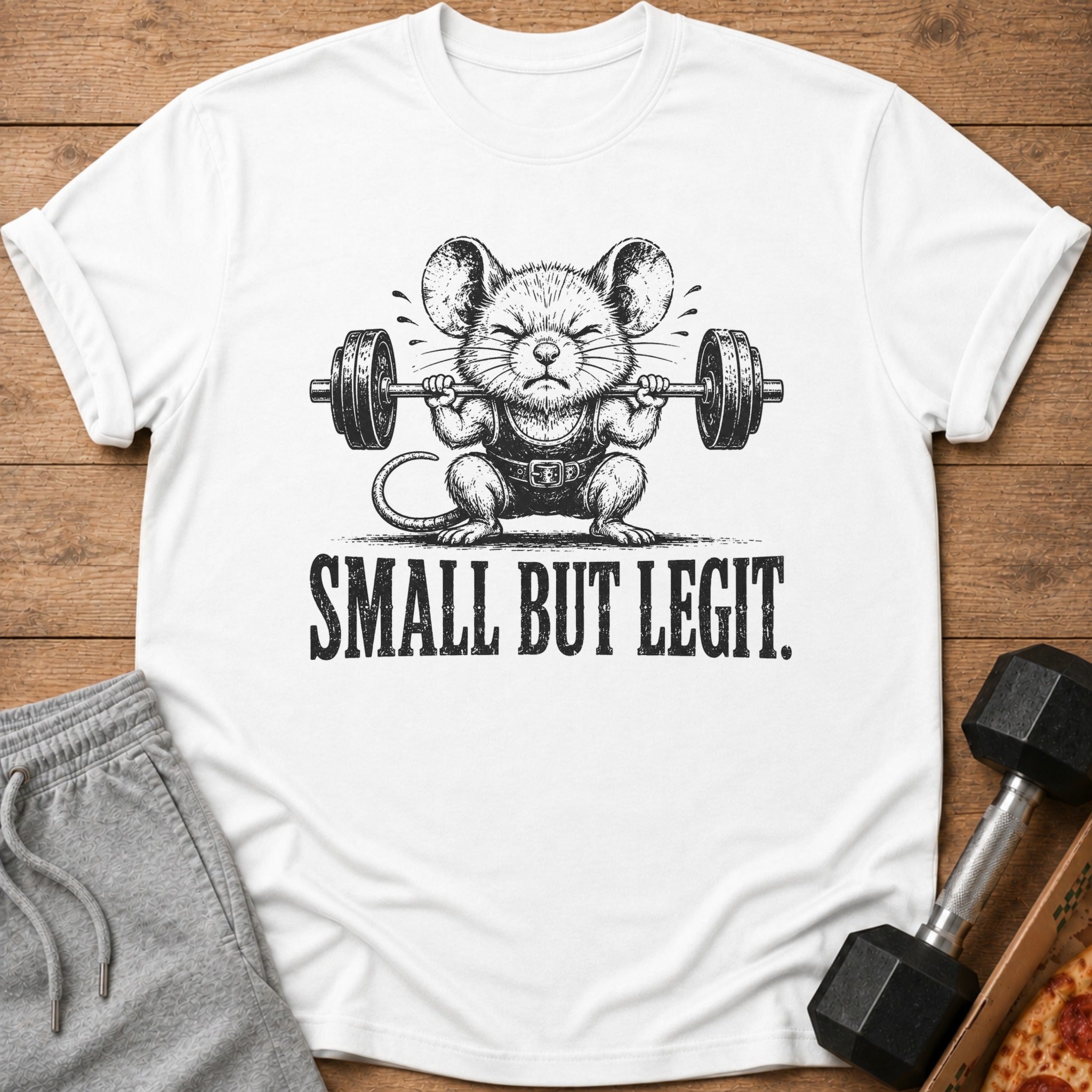 White t-shirt with a drawing of a mouse lifting a barbell and text "SMALL BUT LEGIT."