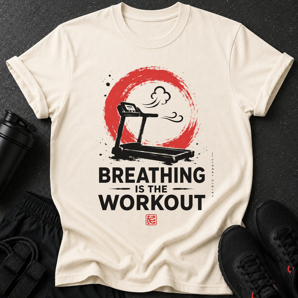 Light tan t-shirt with treadmill graphic and text "BREATHING IS THE WORKOUT".
