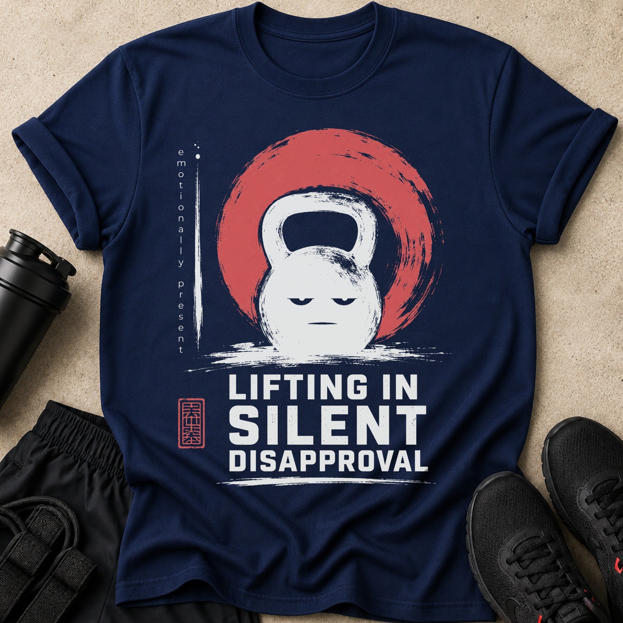 Navy t-shirt with a white kettlebell graphic and "LIFTING IN SILENT DISAPPROVAL" text.